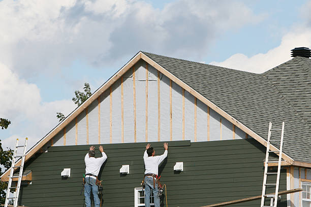 Professional Siding technician working in Penfield, PA